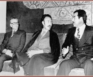The 1975 image that symbolized this turning point brought together Shah Mohammad Reza Pahlavi of Iran, Saddam Hussein of Iraq, and Houari Boumédiène of Algeria, under the supervision of Henry Kissinger.